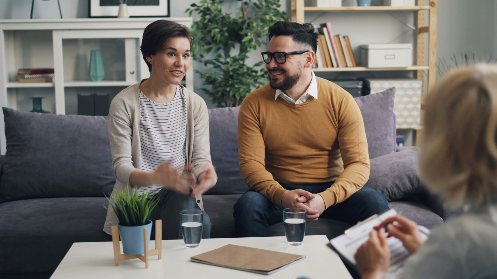 Two people sitting on a couch
