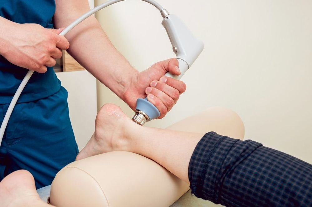 performing shockwave theraphy in the feet performing shockwave theraphy in the feet