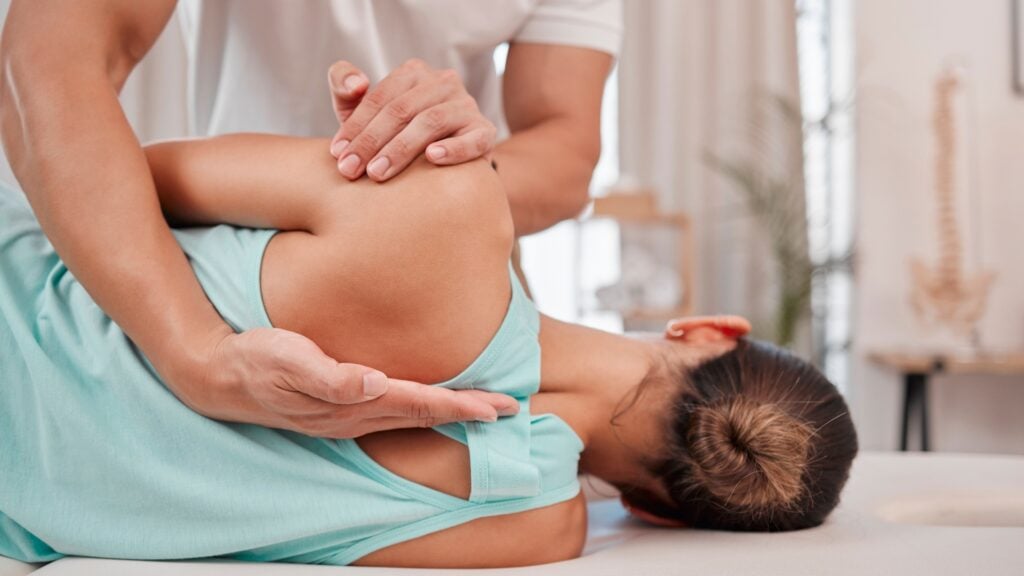 Chiropractic treatment for woman with back pain Chiropractic treatment for woman with back pain